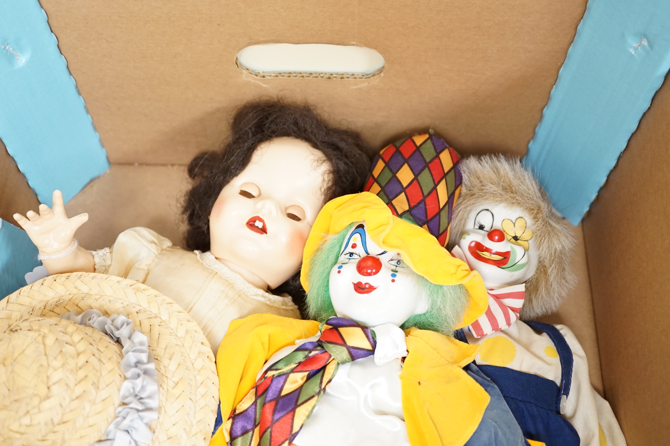 A German bent limb doll, height 63cm, hands damaged, vintage clothes, Cherie French doll's head on replaced new body, two hard plastic dolls, one Pedigree AM Dream Baby doll, soft body, small hard plastic baby in crib